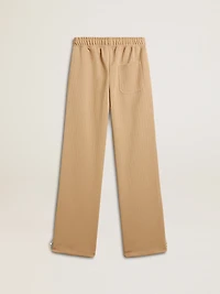 Women’s light beige joggers with white logo