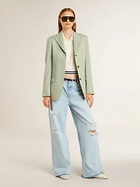 Women's cropped worn-white cotton polo shirt with blue ribbing