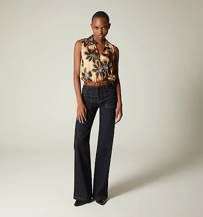 SLEEVELESS CROSSOVER BODYSUIT