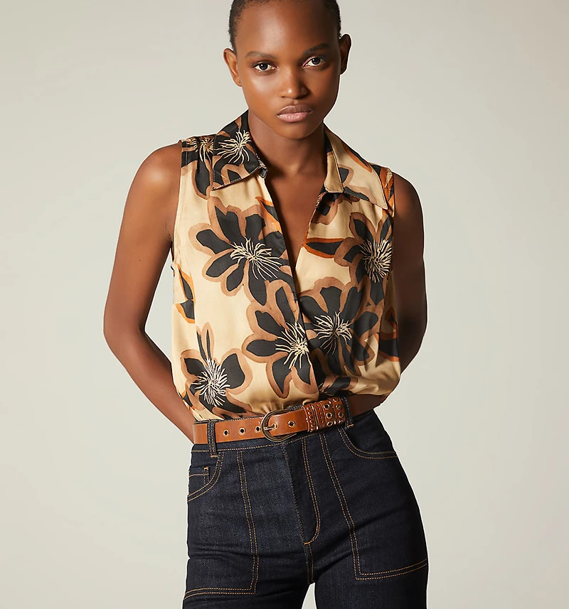 SLEEVELESS CROSSOVER BODYSUIT
