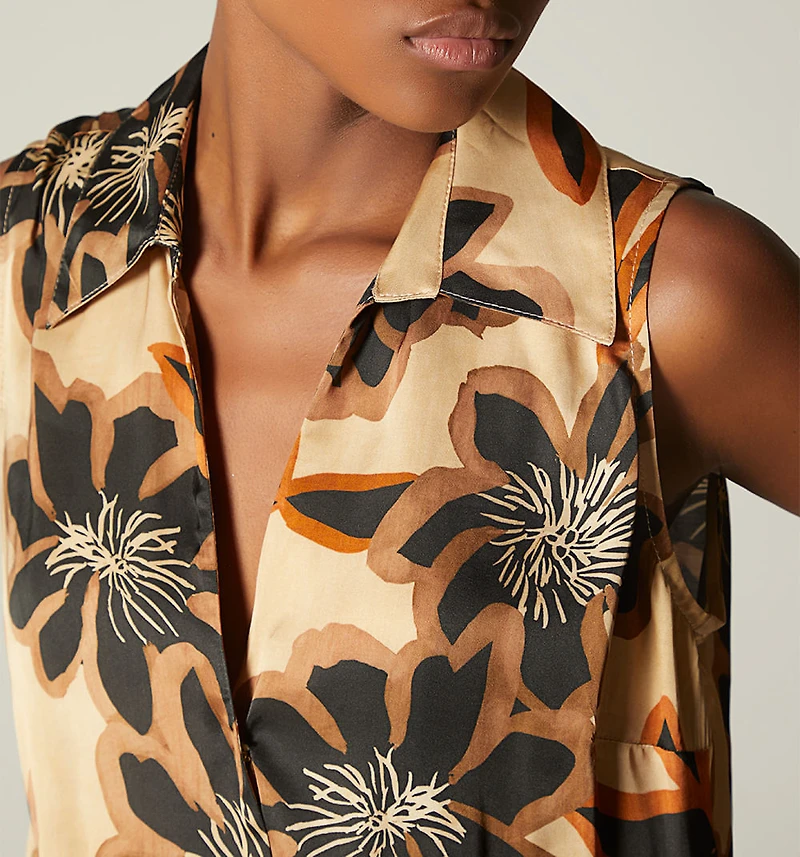 SLEEVELESS CROSSOVER BODYSUIT