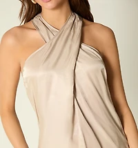 SLEEVELESS CROSSOVER NECKLINE BLOUSE