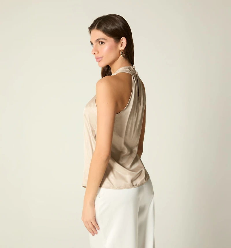 SLEEVELESS CROSSOVER NECKLINE BLOUSE