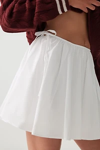 Microjupe circulaire à boucles latérales