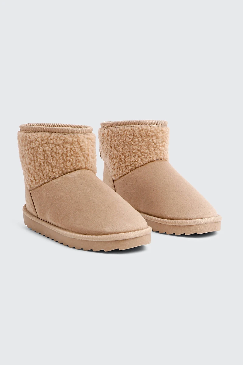 Bottillons en faux mouton à bordure accent