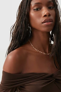 Haut à épaules dénudées torsadé l'avant