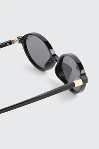 Lunettes de soleil ovales à monture pleine