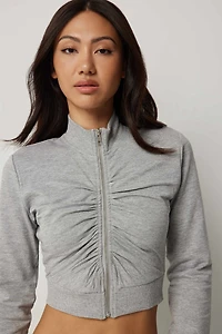 Chandail à col montant froncé glissière