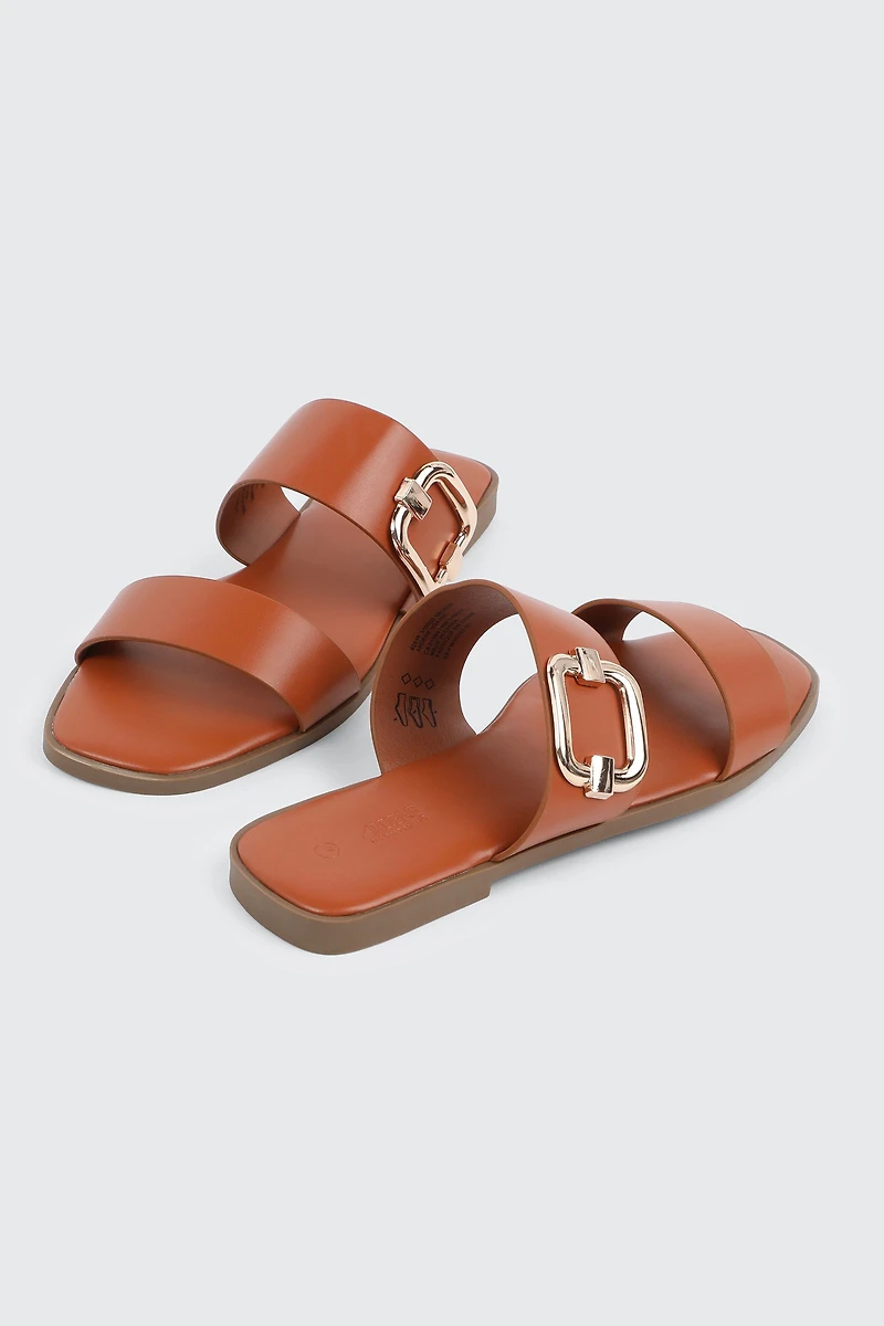 Sandales à talon plat et boucle volumineuse