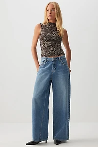 Haut à col montant en maille léopard