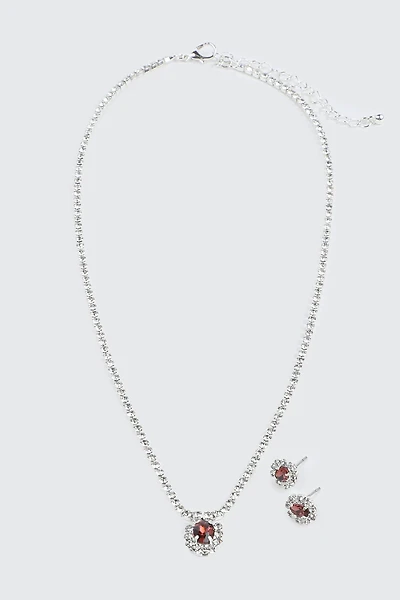 Collier et boucles d'oreilles à pierre rouge