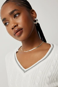 Chandail court en tricot torsadé