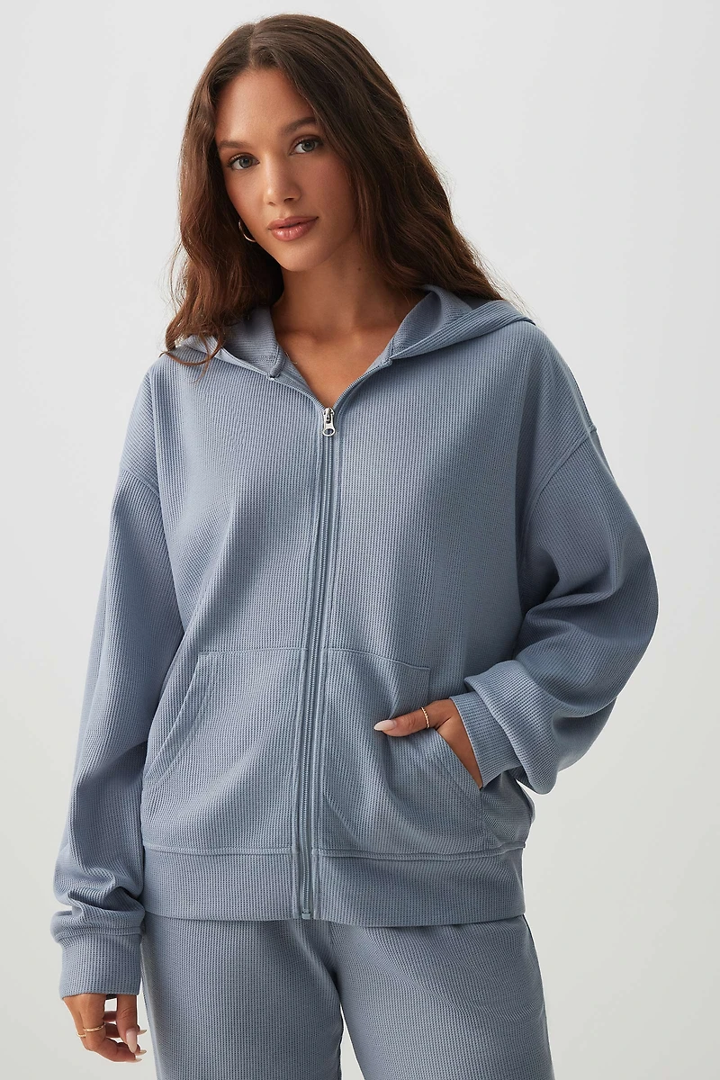 Veste à capuchon et glissière en tricot gaufré