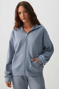 Veste à capuchon et glissière en tricot gaufré