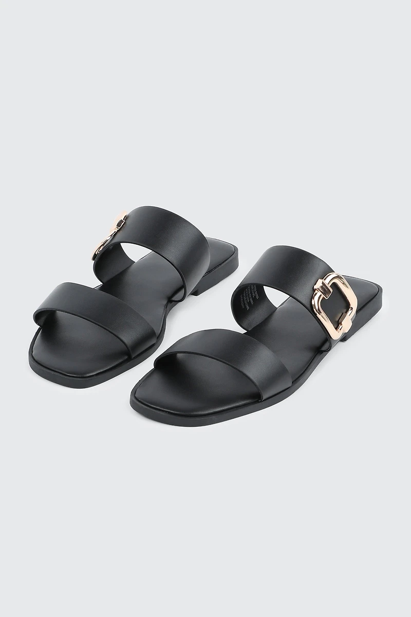 Sandales à talon plat et boucle volumineuse