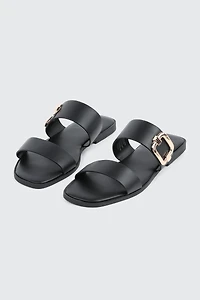 Sandales à talon plat et boucle volumineuse