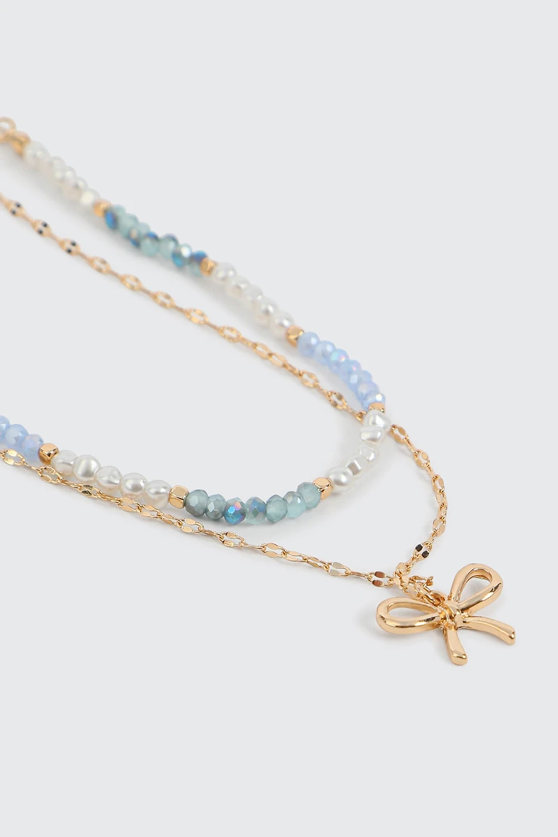 Collier deux rangs perles et boucle