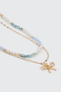 Collier deux rangs perles et boucle