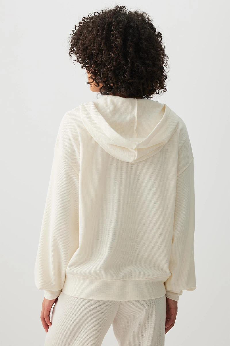 Veste à capuchon et glissière en tricot gaufr