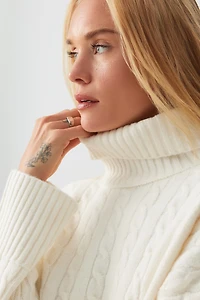 Chandail à col roulé en tricot torsad