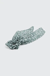 Chouchou tissé à pointes et motif floral