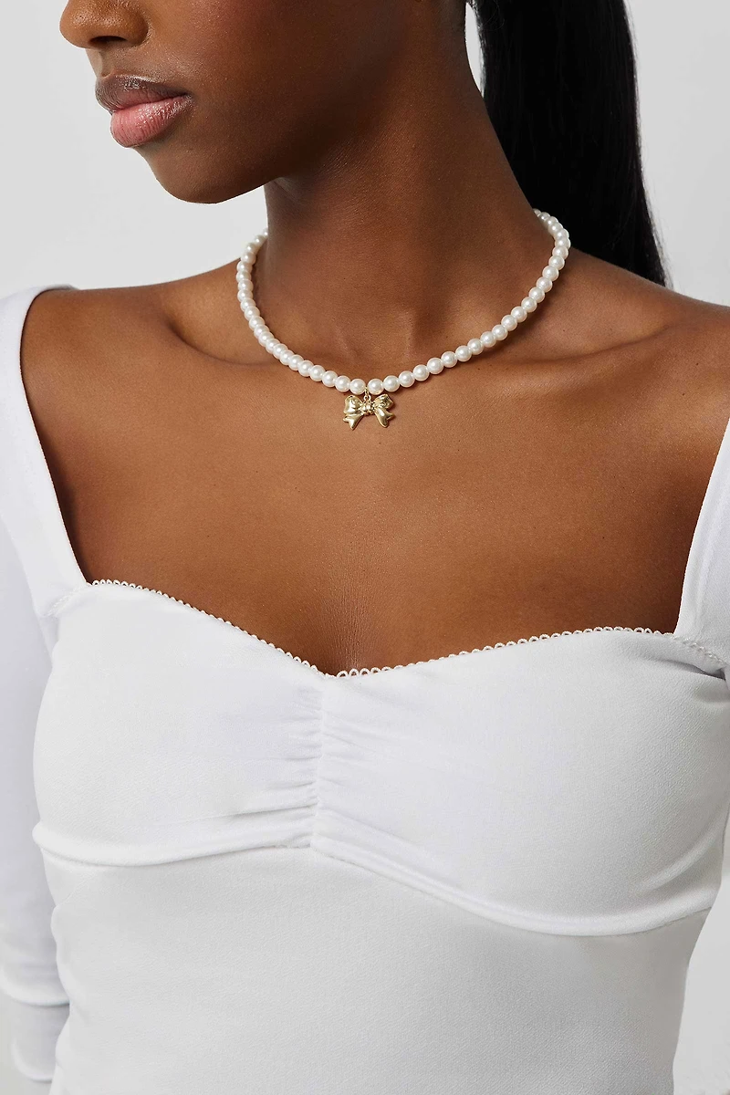 Haut à manches longues et coutures bustier