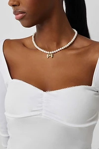 Haut à manches longues et coutures bustier