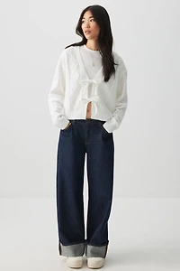 Chandail en tricot torsadé noué à l'avant