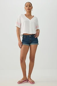 Short taille basse en denim extensible