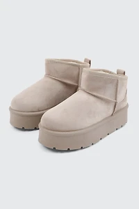 Bottes plateformes mini en faux mouton