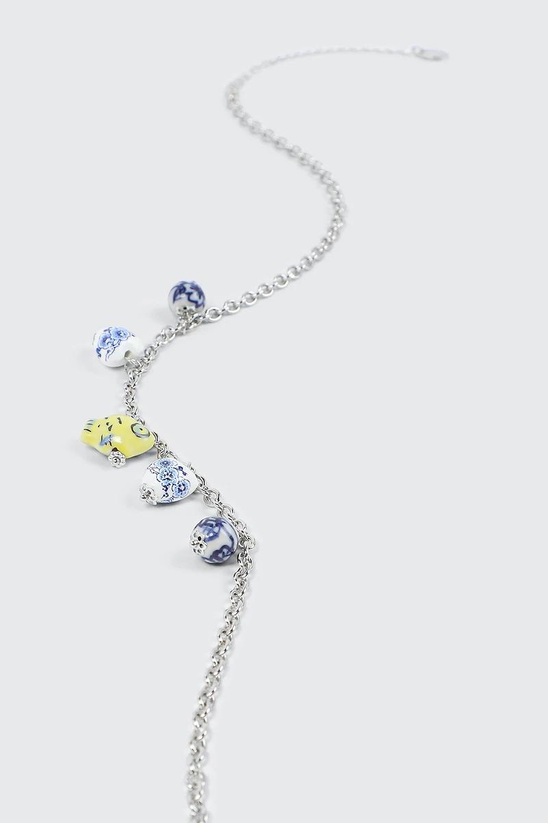 Collier à breloques cœurs et poissons