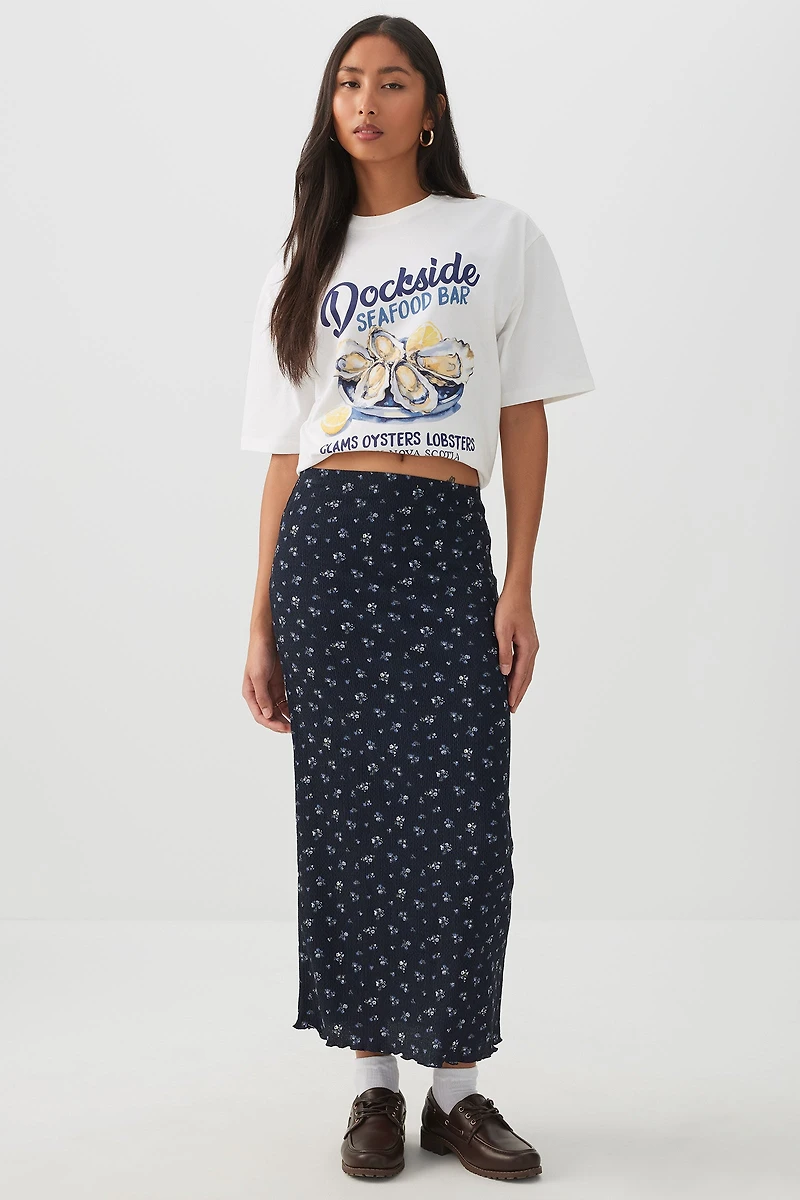 Jupe midi fleurie à bordure frisons