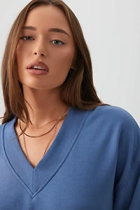 Chandail à col V en jersey bouclette