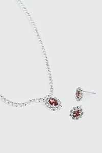 Collier et boucles d'oreilles à pierre rouge