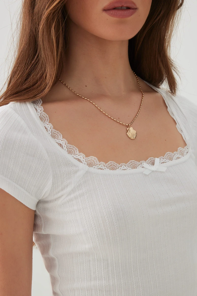 T-shirt à col dégagé et bordure en dentelle