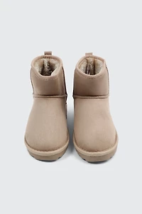 Bottes mini en faux mouton