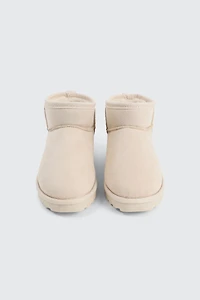 Bottes mini en faux mouton