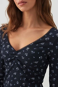 T-shirt à col V et manches longues fleuri