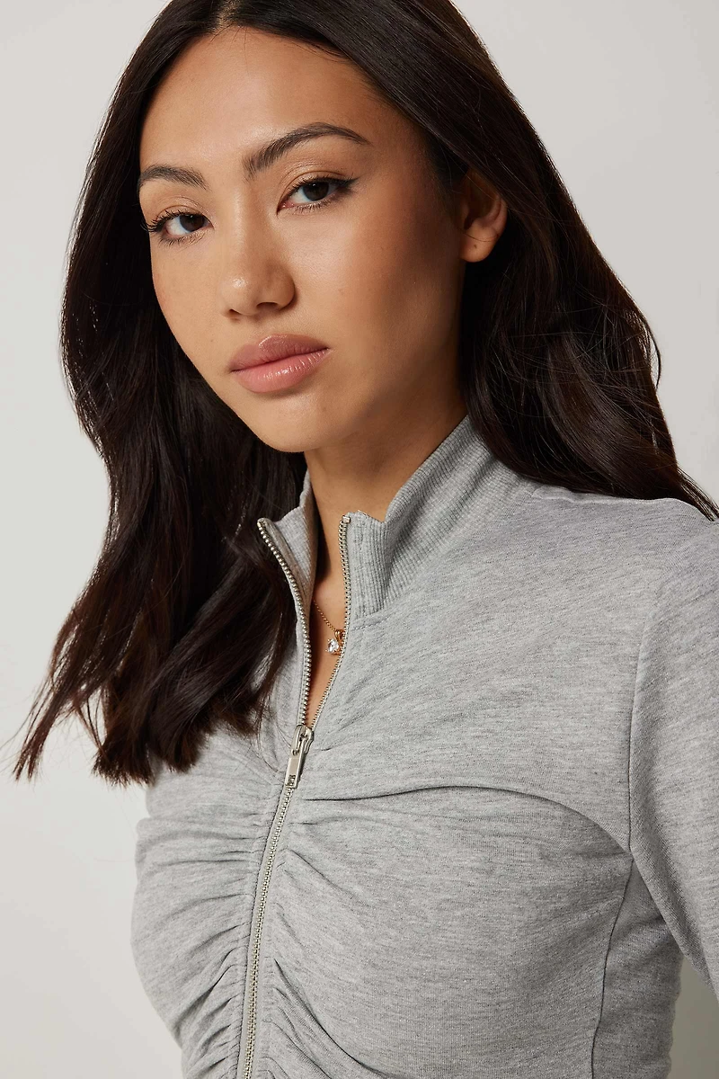 Chandail à col montant froncé glissière