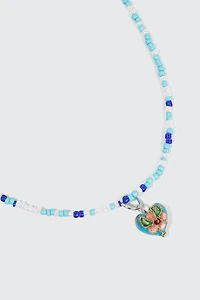Collier de petites perles avec cœur à fleur