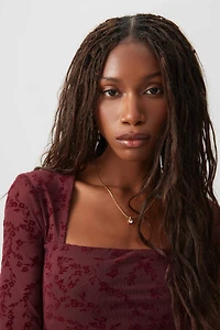 Haut en maille à fleurs floquées