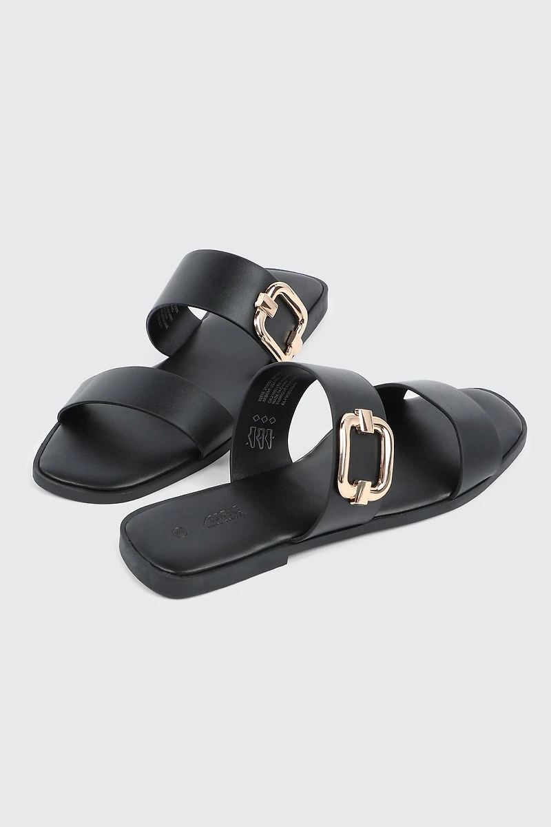 Sandales à talon plat et boucle volumineuse