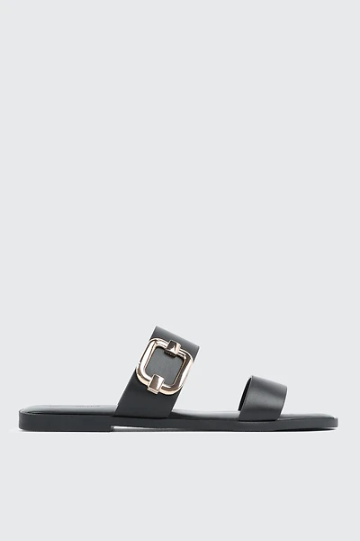 Sandales à talon plat et boucle volumineuse