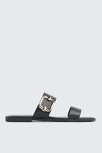 Sandales à talon plat et boucle volumineuse