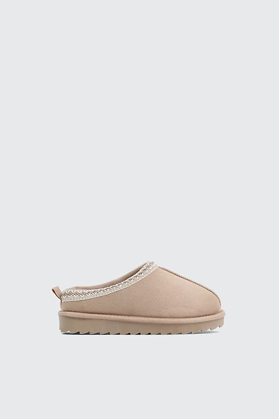 Sabots en faux mouton à bordure accent