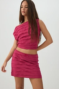 Haut court asymétrique à volants