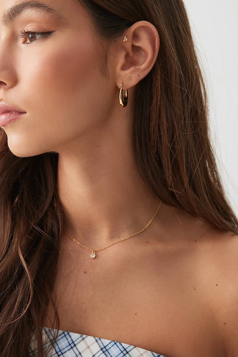 Ardene Stainless Steel Oval Hoop Earrings in Gold