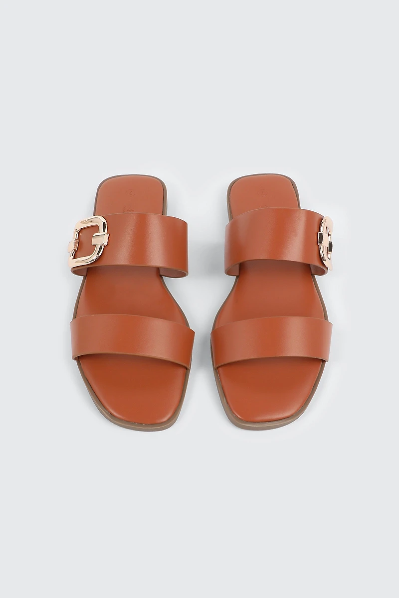 Sandales à talon plat et boucle volumineuse