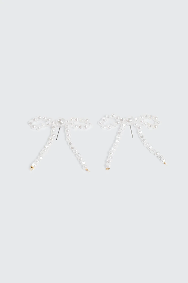 Ardene Pearl Bow Shape Earrings in White | Stainless Steel
