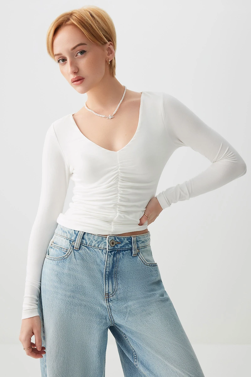 Haut à manches longues froncé l'avant